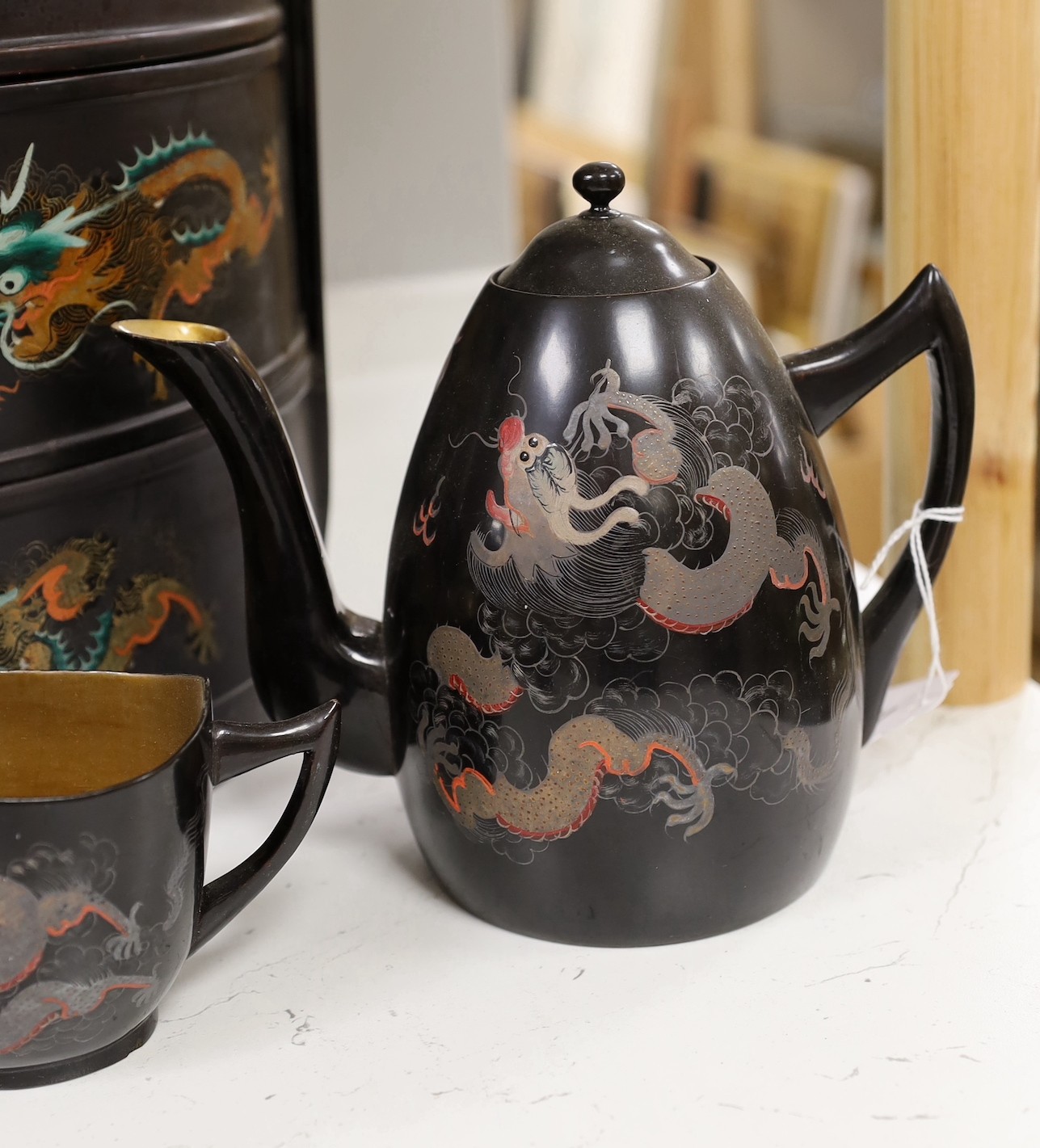 A Chinese Fuzhou lacquer ‘dragon’ wedding basket, 31cm high together with a similar teaset